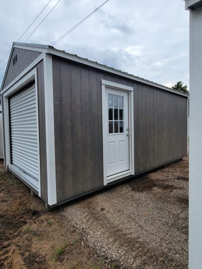 A 12x20 Garage Shed featuring a convenient garage door. Whether you're looking for a shed store nearby or interested in sheds on sale, this 12x20 Garage Shed is the perfect solution for your storage needs.