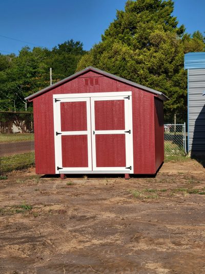 A red 10x12 Basic Shed with a white door available for sheds on sale.