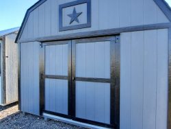 A 12x20 Lofted Barn Shed with a star on it available for sale.