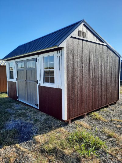 A brown and black 10x16 Garden Shed with a metal roof available for sale.