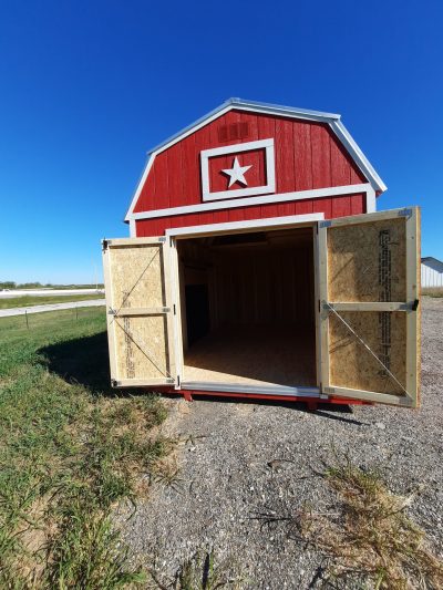 A 10x16 Lofted Barn Shed with an open door for sale.