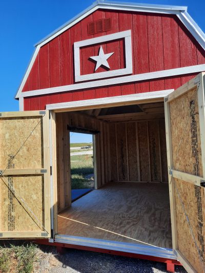 For sale: A red 10x16 Lofted Barn Shed with a star on the door. If you are seeking sheds on sale or looking for a shed store near you, this could be the perfect option.