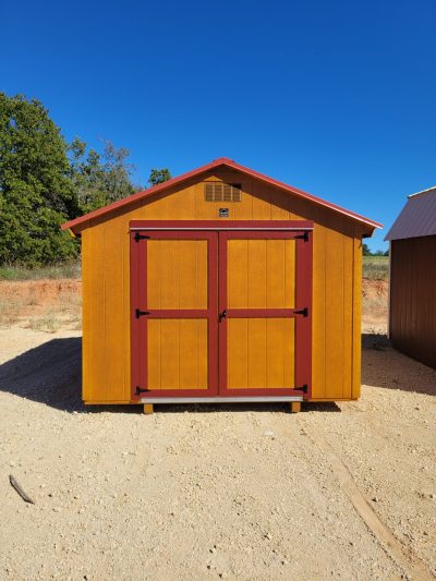 For sale: A 10x12 Basic Shed sitting on a dirt lot, available at the shed store near me.