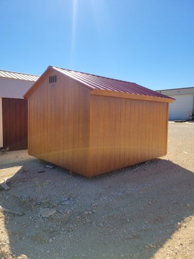 For sale shed: A 10x12 Basic Shed with a red roof sitting in the dirt available at a discounted price.