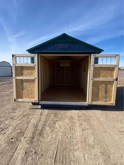 A small 8x14 Utility Shed available for sale in a dirt lot near me.