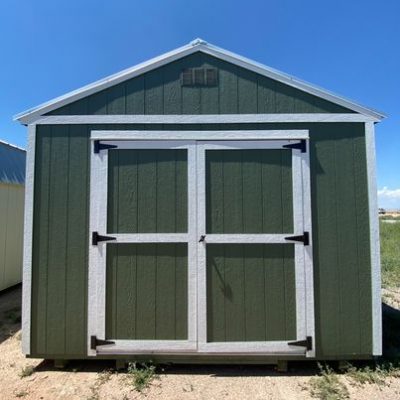 A 12x24 Utility Shed with a white door for sale.