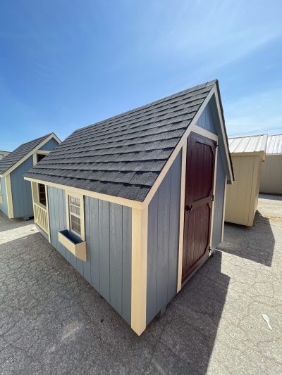 For sale: A 8x12 Hideout Playhouse Shed with a blue roof and a black roof.