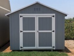 A 10x12 Basic Shed with a white door available for sale at a shed store near me.
