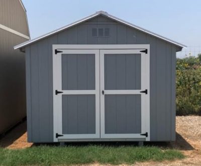 A 10x12 Basic Shed with a white door available for sale at a shed store near me.