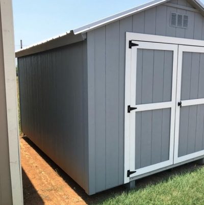 A 10x12 Basic Shed with a white door available for sale.