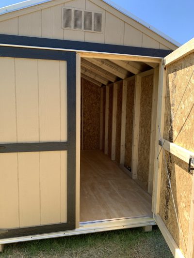 An 8x12 Basic Shed for sale with a door open.
