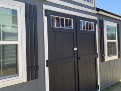 A 10x20 Chalet Shed with windows and doors for sale.