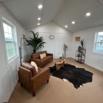 A living room with a 14x24 Diamond Cabinette Shed and a cowhide rug for sale. - LELAND'S SHEDS - A living room with a 14x24 Diamond Cabinette Shed and a cowhide rug for sale.