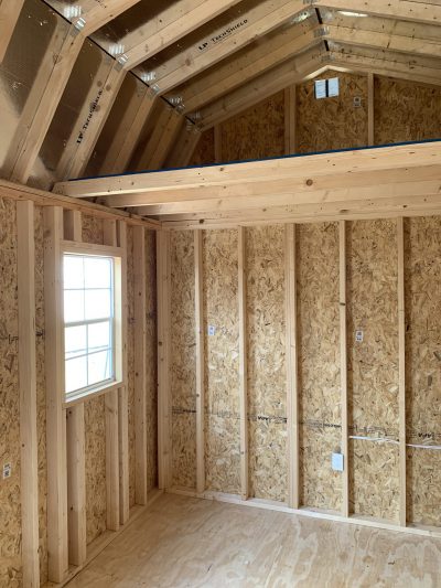 The description of a 10x20 Lofted Barn with wood walls and a window.