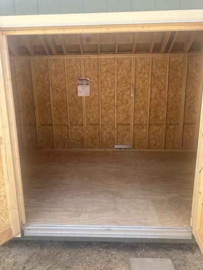 A 10x20 Chalet Shed with a door open, available for sale near me.