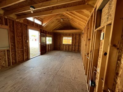 The inside of a 12x24 Chalet Shed with wood framing near me.