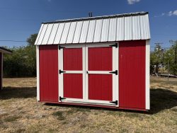 A red and white 10x12 Lofted Barn with a metal roof available for sale.