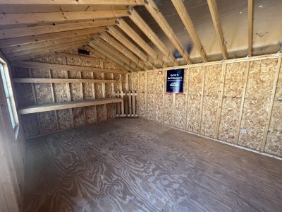 The inside of a 12x16 Utility Shed with plywood walls for sale near me.