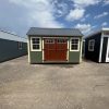 For sale, two 10x14 Garden Sheds conveniently located in a parking lot.