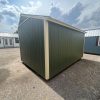 A 10x14 Garden Shed for sale in a parking lot near me.
