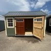 A 10x14 Garden Shed with an open door, available for sale near me.