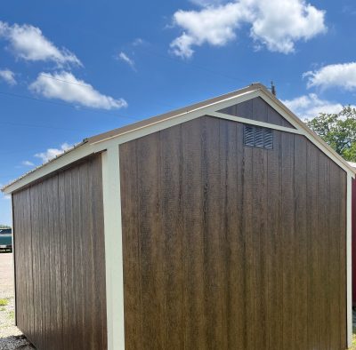 A 10x12 Utility Shed for sale with a blue sky behind it.