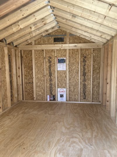 A 10x12 Utility Shed with wood flooring and plywood walls that is available for sale.