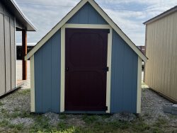 For sale: A 8x12 Hideout Playhouse Shed with a blue door and a red door.