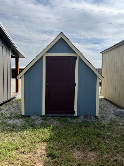 For sale: A 8x12 Hideout Playhouse Shed with a blue door and a red door.