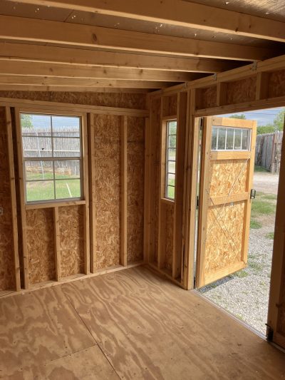 For sale: The inside of an 8x12 Studio Shed with a door.
