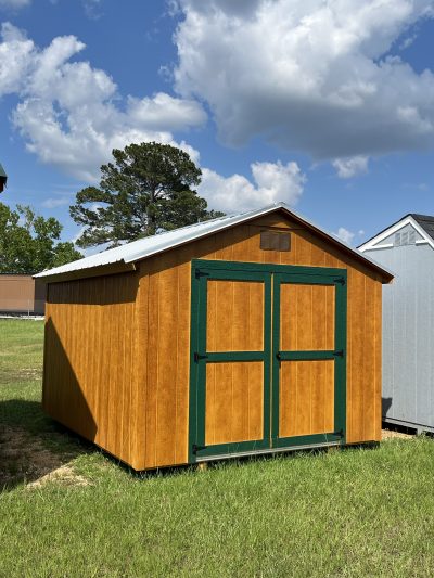 For sale: Two 10x12 Basic Sheds on sale, conveniently located near me. These wooden structures are situated in a picturesque field, side by side. Visit our shed store today to explore the options!