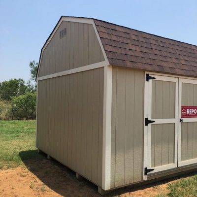 A 10x16 Lofted Barn with a red sign on it, available for sale.