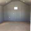 For sale: A 14x20 Diamond Cabinette Shed with gray walls and a white floor.
