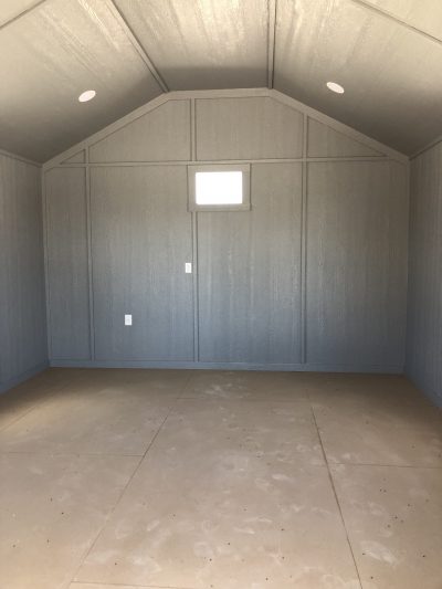 A room with a grey wall and white ceiling, perfect for displaying the 14x20 Diamond Cabinette Shed on sale.