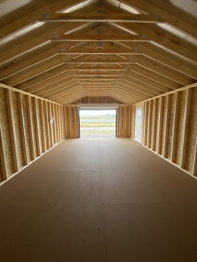 The inside of a 16x28 Garage Style Shed available for sale.