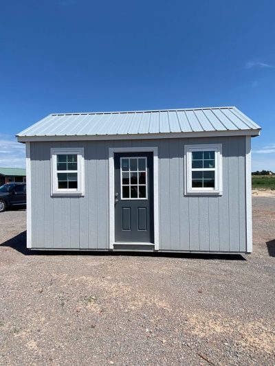 A 10x16 Chalet Shed for sale in a parking lot.