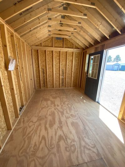 A 10x16 Chalet Shed with a door, available for sale near me.