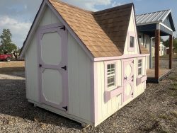 For sale: A 8x10 Victorian Play House Shed with a pink roof.