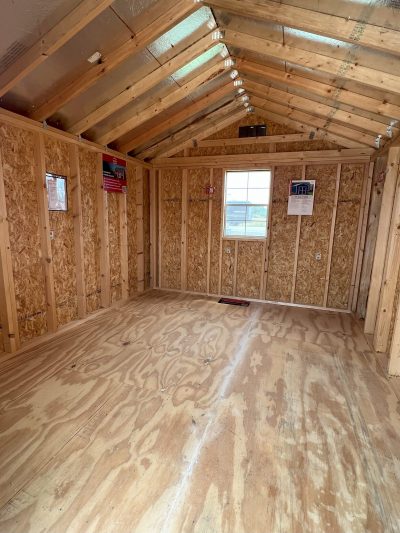 The inside of a 10x12 Utility Shed with wood flooring is available for those looking for sheds on sale.