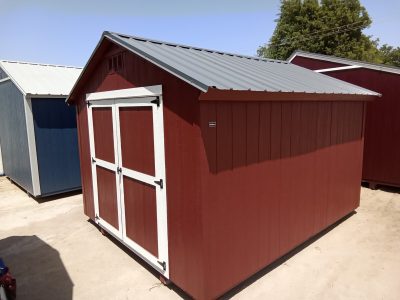 For sale 10x12 Basic Shed: A red and white shed with a metal roof available.
