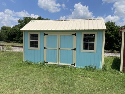 A 10x16 Garden Shed for sale in a field.