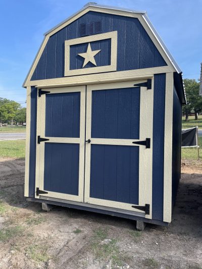 For sale: A blue and white 8x10 Lofted Barn with a star on it.