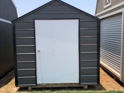 Two 8x10 Metal Sheds for sale in a grassy area.