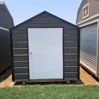 Two 8x10 Metal Sheds for sale in a grassy area.