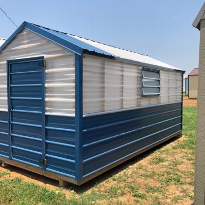 For sale, 8x16 Greenhouse Shed: A blue and white shed sitting on a grassy area.