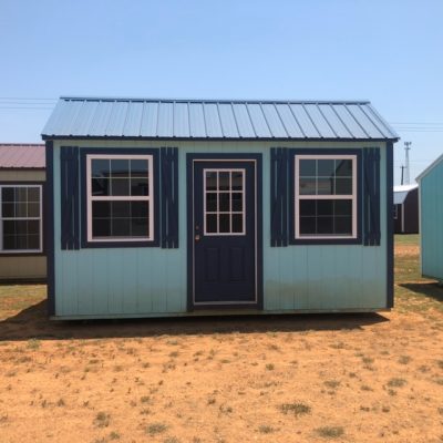 For sale, two 10x16 Garden Sheds in a field.