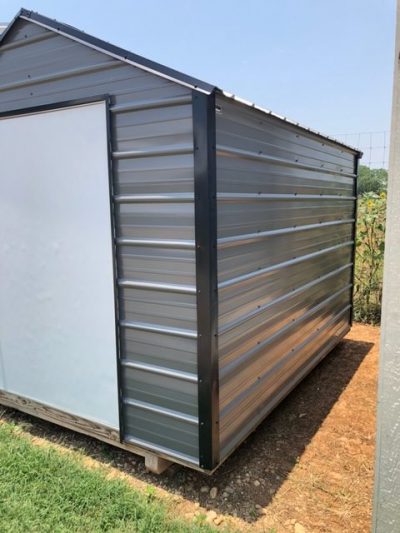 For sale: An 8x10 Metal Shed with a door on it.