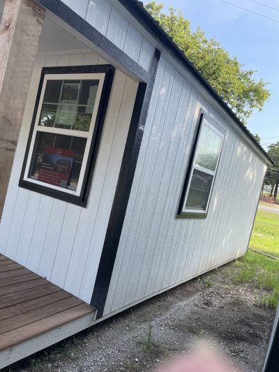 A 10x24 Cabinette Shed for sale with a porch.