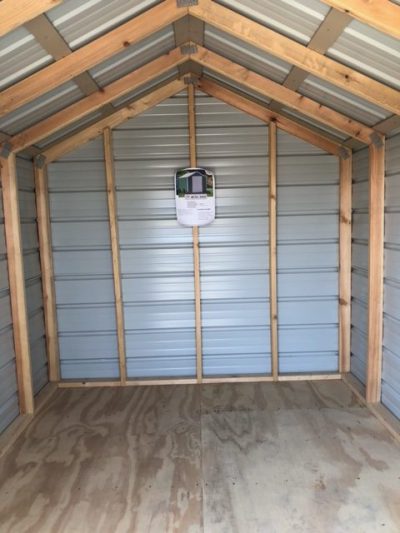 An 8x10 metal shed for sale with a metal roof at a shed store near me.