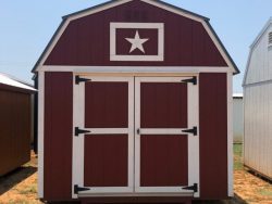 A red and white 10x16 Lofted Barn with a star on it, perfect for those looking for 10x16 Lofted Barns on sale or in need of a 10x16 Lofted Barn for sale near me.